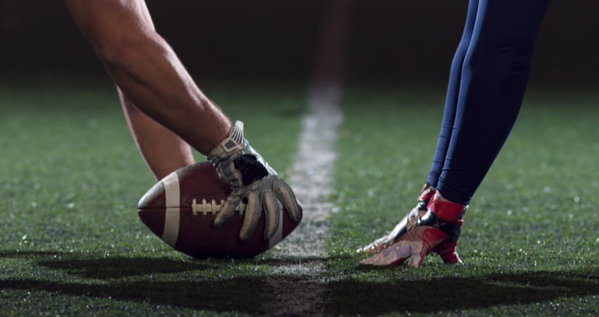 two football players at kick off