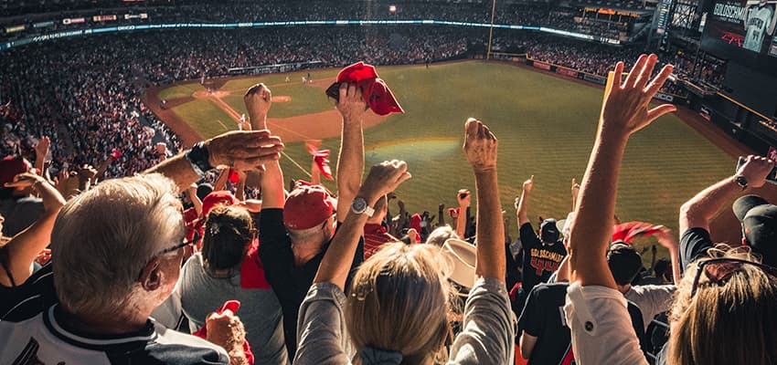 Fans cheer in their seats at Chase Field in Phoenix, AZ