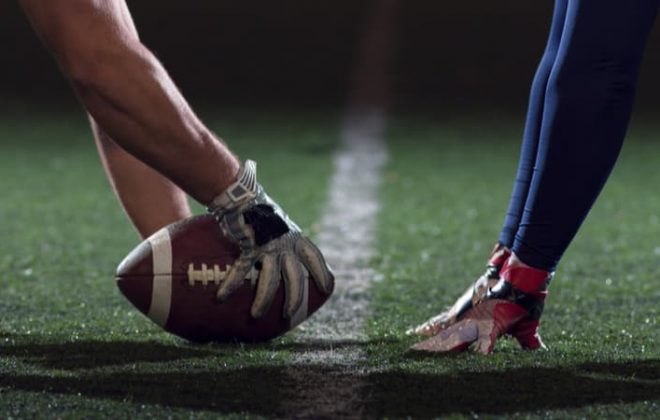 two football players at kick off