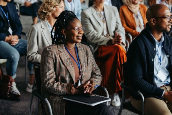 a crowd of professionals at a corporate event